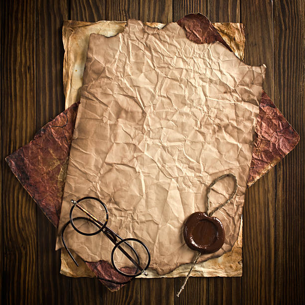 istock Old paper on the wood background 502814763