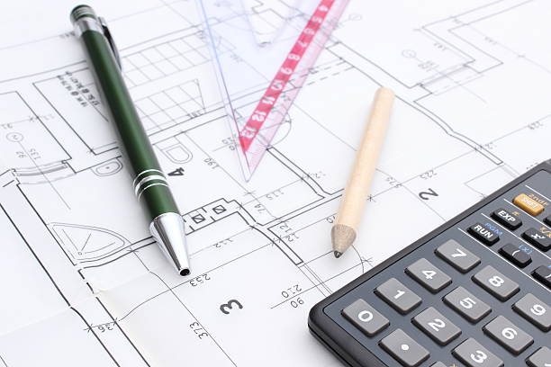 istock Drawing accesories and calculator on housing plan 502815153