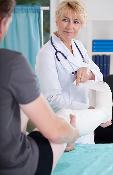 istock Man with leg in plaster cast 502816115