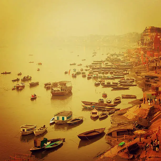 Small boats at Ganga river - instagram effect. Sunrise photo with retro filter. India, Varanasi.