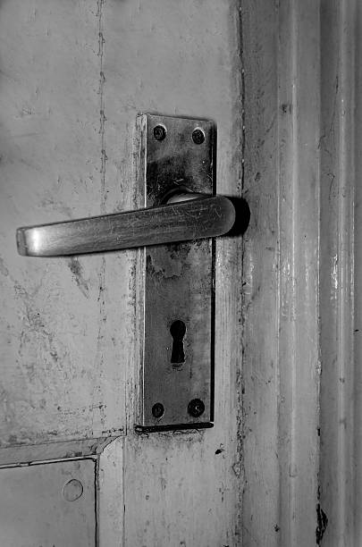 istock door handle, old, dirty, black and white image 502817497