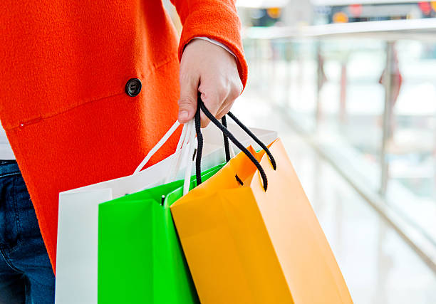 istock holding shopping bags 502817726