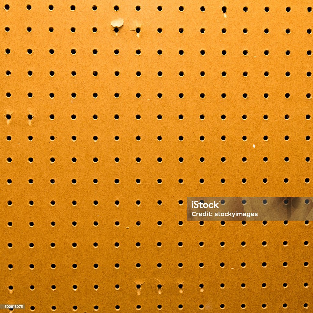 Peg board texture closeup Peg board texture. Square to screen dimension Pegboard Stock Photo