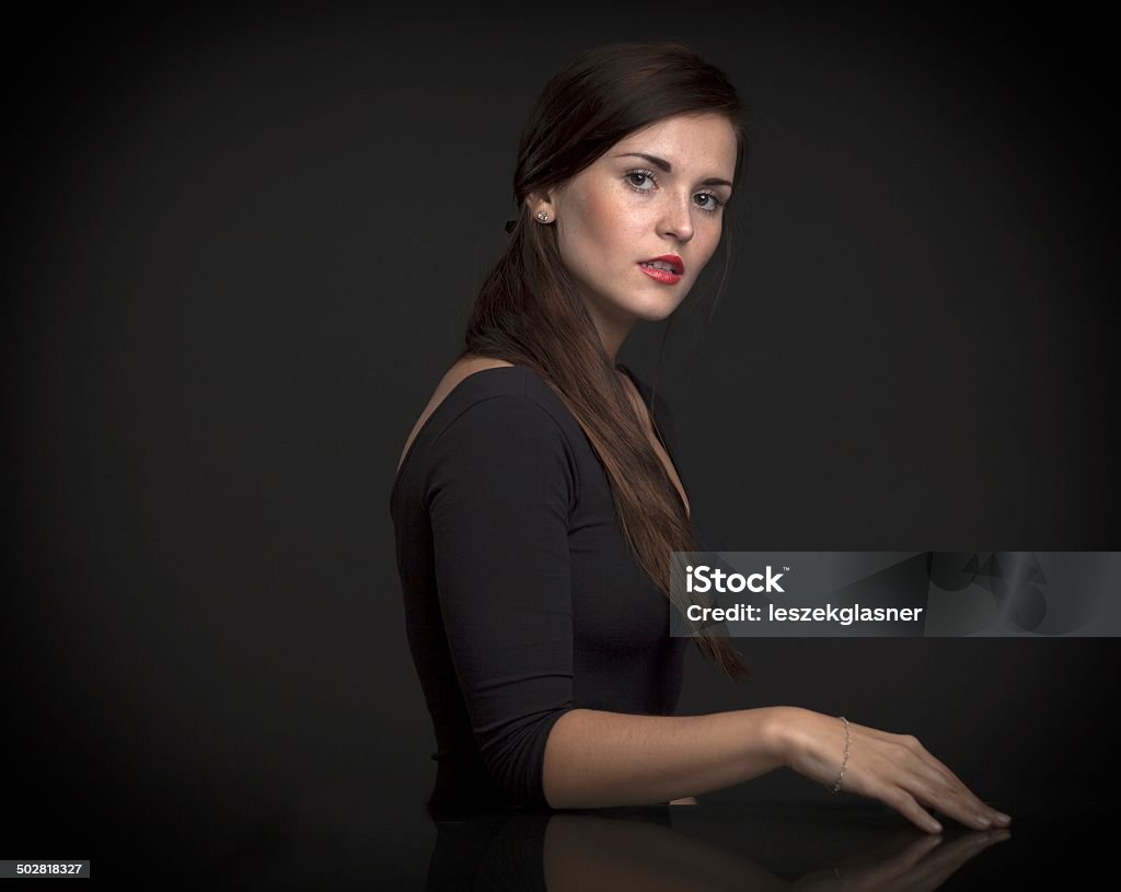 Painterly portrait of a beautiful woman Painterly portrait of a beautiful woman in dark studio Adult Stock Photo