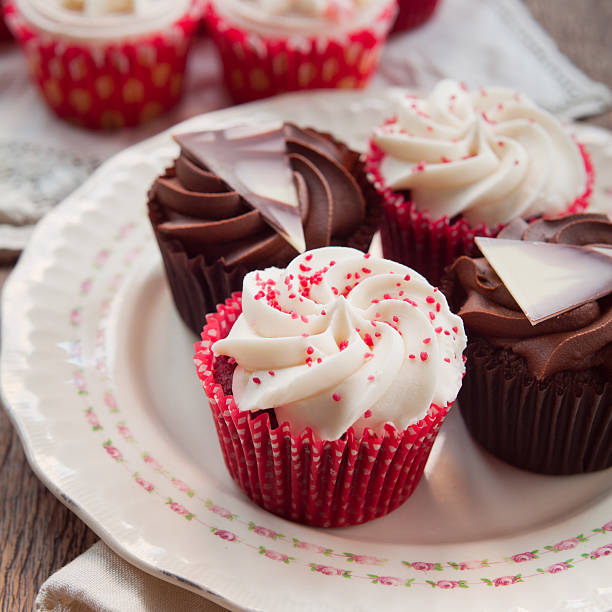 istock White and dark  chocolate cupcakes on natural rustic vintage table 502818934