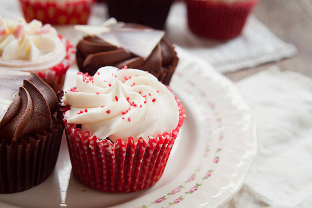istock White and dark  chocolate cupcakes on natural rustic vintage table 502819000