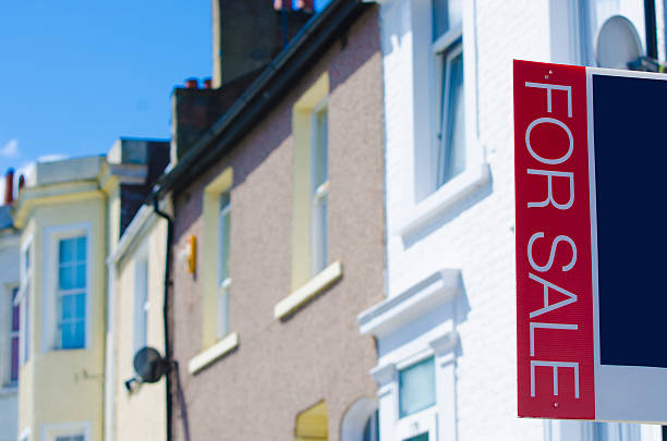 istock houses with sale sign horizontal 502819437