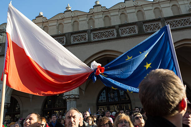 Cracow, Main Square - The demonstration Cracow, Poland - December 19, 2015: Cracow, Main Square -  The demonstration of the Committee of the  Protection of the Democracy /KOD/ against the break of law through the government PIS in Poland.  solidarity labor union stock pictures, royalty-free photos & images