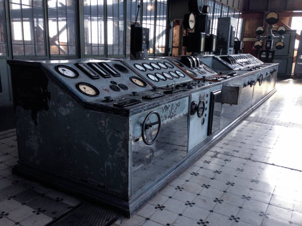 Machine buttons on a relic control panel operating board inside an abandoned factory.