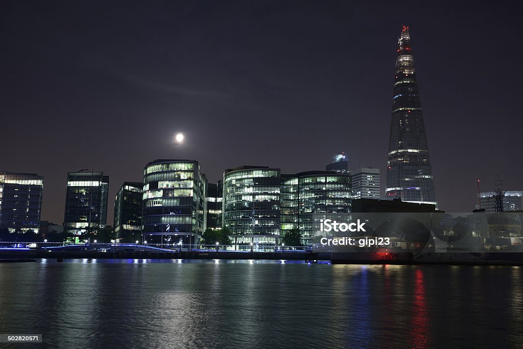 London at night with The Shard peaking above the Thames London cityscape with The Shard at night Architecture Stock Photo