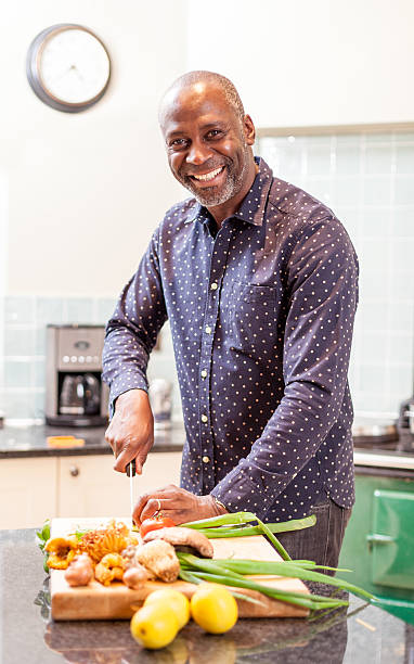 istock African man with big smile preparing food 502821127