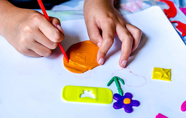 istock children playing with modeling clay, colour image 502821489