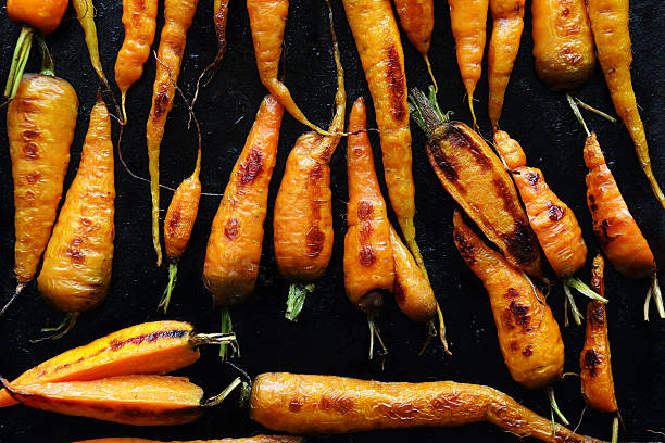 istock roast carrots on black tray 502822148