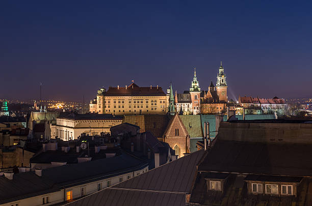 Krakow old town seen from the Town Hall tower Old town, royal castle and cathedral on the Wawel hill seen from the Town Hall tower in Krakow, Poland in the night wawel cathedral photos stock pictures, royalty-free photos & images