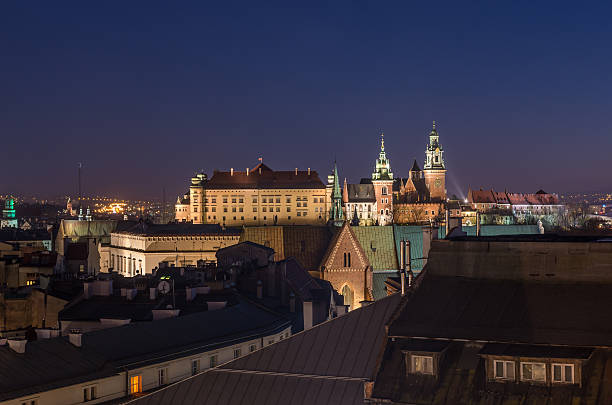 Krakow old town seen from the Town Hall tower Old town, royal castle and cathedral on the Wawel hill seen from the Town Hall tower in Krakow, Poland in the night wawel cathedral stock pictures, royalty-free photos & images