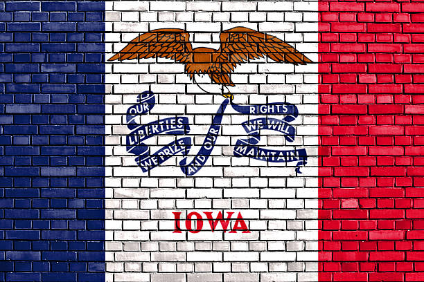 flag of Iowa painted on brick wall flag of Iowa painted on brick wall iowa flag stock pictures, royalty-free photos & images