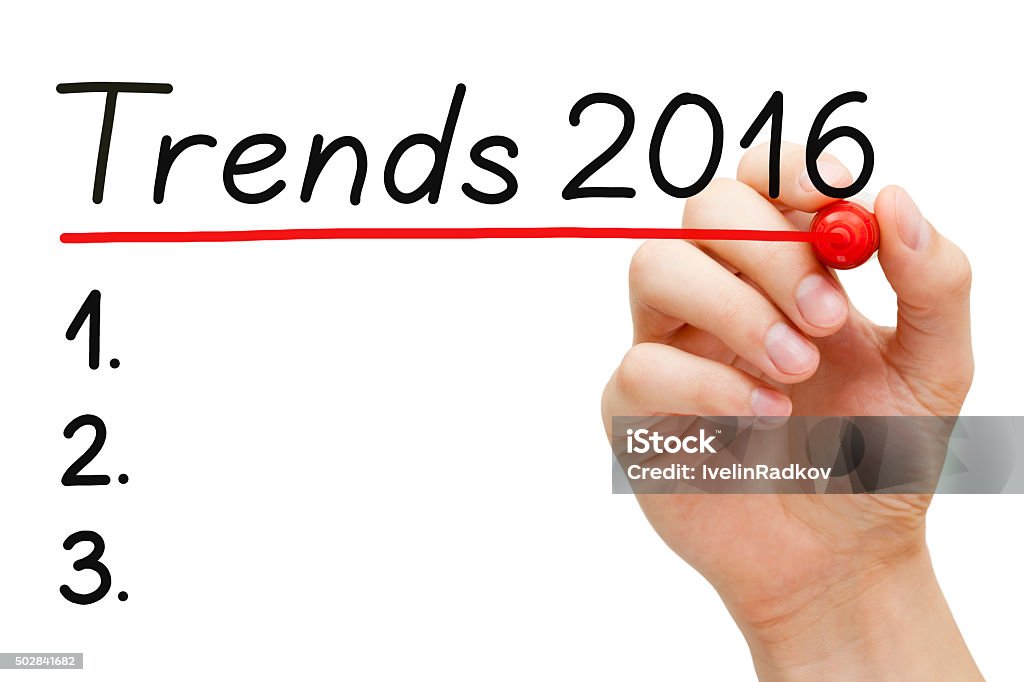 Trends 2016 List Concept Hand writing Trends for 2016 list with marker on transparent wipe board isolated on white.  2015 Stock Photo