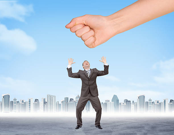 istock Hand trying to splash businessman 502841968