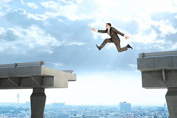 istock Image of young businessman jumping over gap 502842172