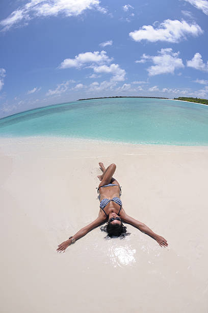 istock happy young couple have fun on beach 502842740