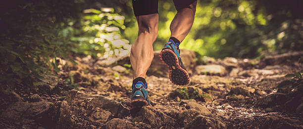 istock Man running uphill on a rocky forest path 502843970