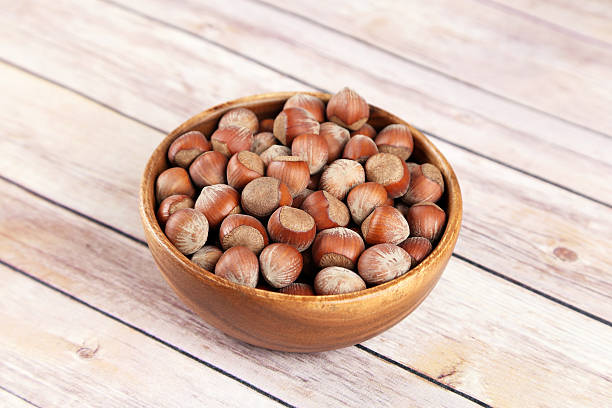 istock Hazelnuts in a wooden bowl 502845350