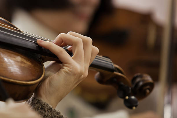 istock Hand girl on the strings violin 502848530