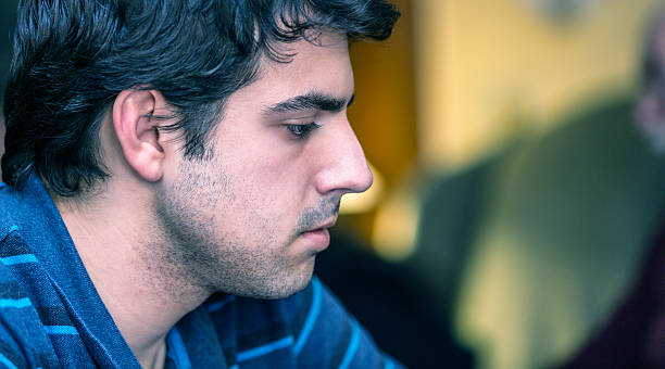 istock College Student Young Man Side View Portrait Close-Up 502849078