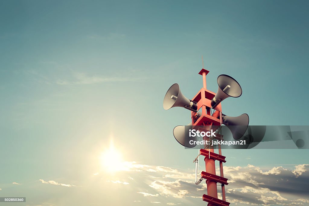 public relations sign Horn speaker for public relations sign symbol, vintage color - sun with blue sky Emergency Siren Stock Photo