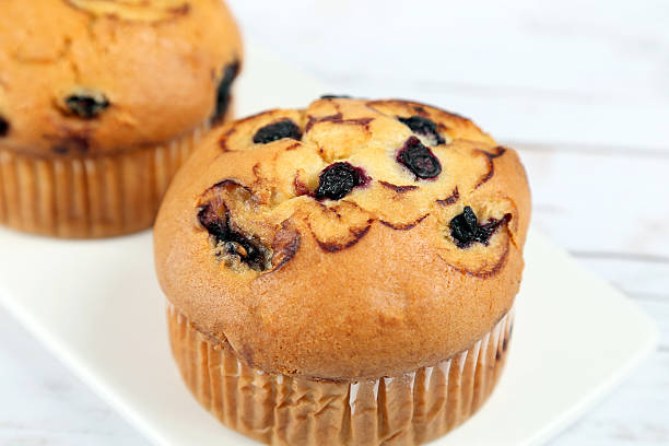 istock Blueberries muffins on wooden background 502851174