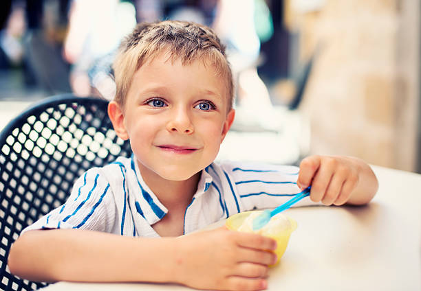 istock Little boy eating ice cream. 502857337