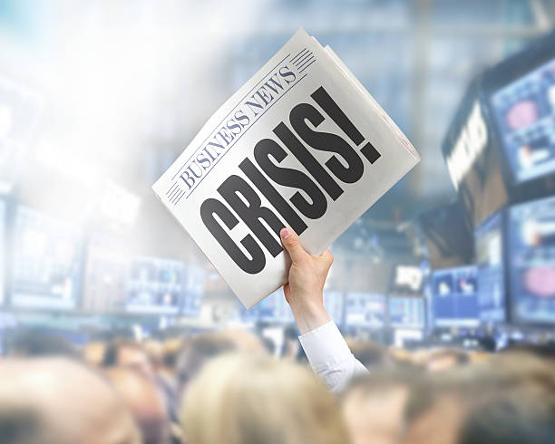 istock Holding Newspaper with Crisis 502857925