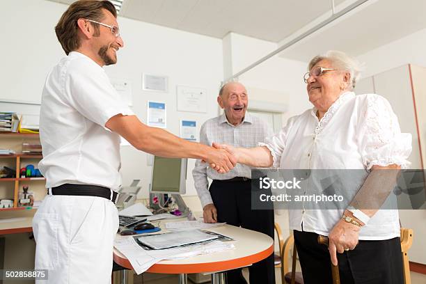 Relieved Elderly Couple Saying Goodbye Stock Photo - Download Image Now - 80-89 Years, Adult, Cardiologist