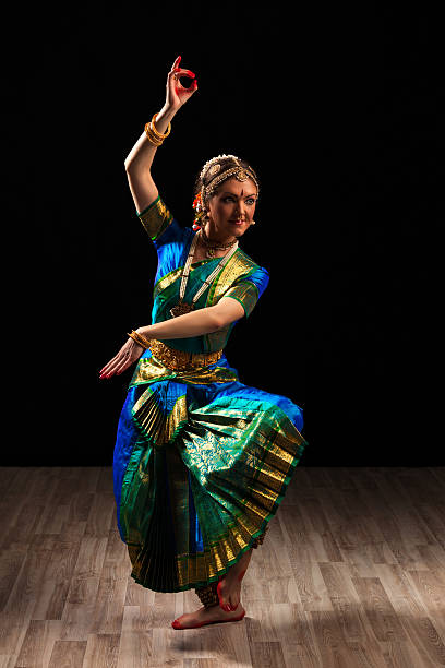 Beautiful girl dancer of Indian classical dance Bharatanatyam Young beautiful woman dancer exponent of Indian classical dance Bharatanatyam in Shiva pose bharatanatyam dancing stock pictures, royalty-free photos & images