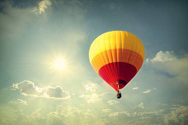 istock Hot air balloon with sun sky 502860022