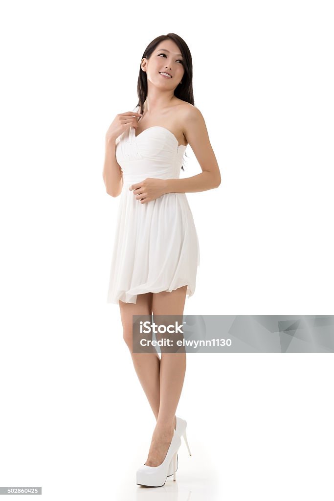 Smiling Asian young woman Smiling Asian young woman, full length portrait isolated on white. Adult Stock Photo
