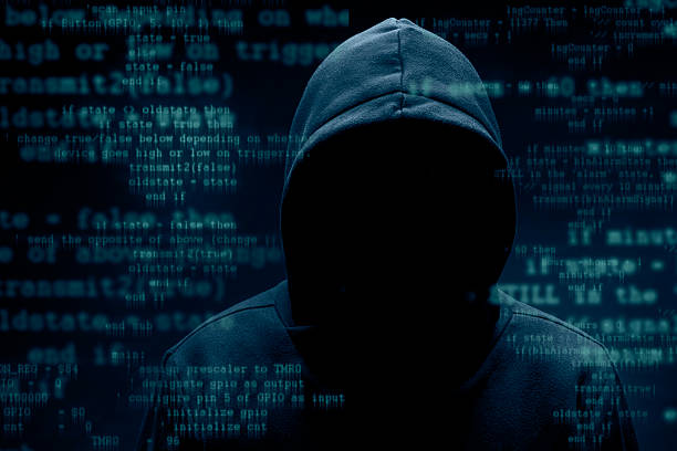 Hacker Hooded hacker. Cyber attack concept. computer hacker stock pictures, royalty-free photos & images