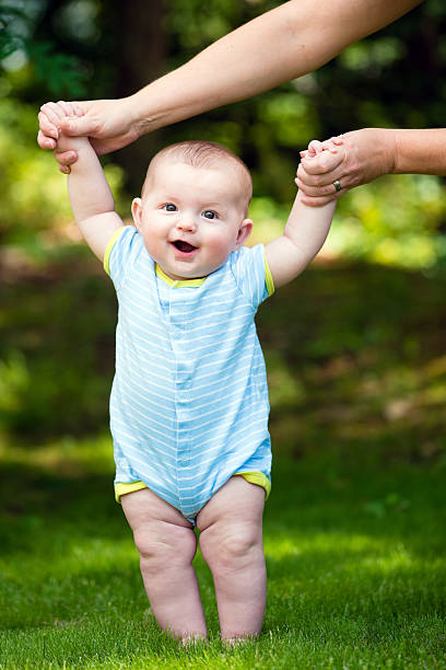 istock Happy baby boy learning to walk 502861943