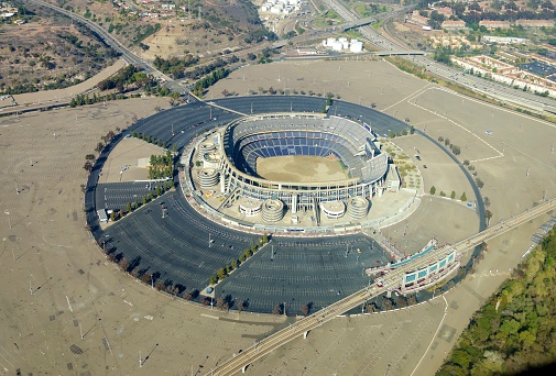 San Diego, United States of America - February 26, 2014: Aerial view of Qualcomm Stadium, San Diego in Southern California, United States of America and trolley line. A stadium used for concerts, the super bowl, football, baseball games and other sports.