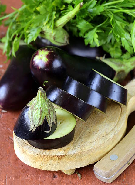 istock fresh ripe vegetables purple eggplant on a wooden table 502862471