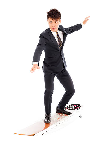 istock businessman practice surfing pose with suit 502862835