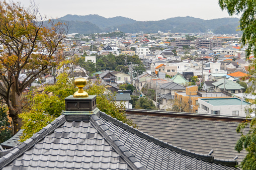 Kamakura, Japan - November 23, 2015: Traditional Japanese rooftops in the town of Kamakura. Photo was during the day from the vantage point at Hasedera Temple.