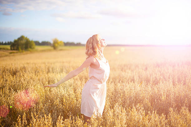 istock Beautiful woman walking on wheat field 502865408