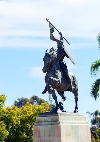 San Diego, United States of America - February 23, 2014: The statue of El Cid, Rodrigo DÃ­az de Vivar, a spanish medieval hero on a horse holding a spear and shield. The sculpture was a gift by Anna Hyatt in Balboa Park, San Diego, California in plaza de Panama