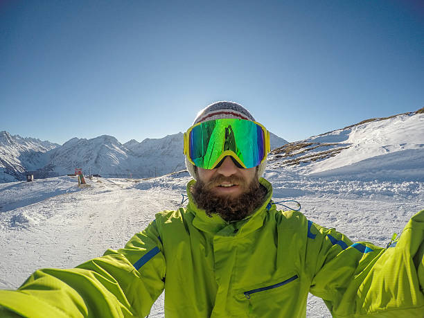 istock Young man takes selfie portrait on ski slopes 502866052