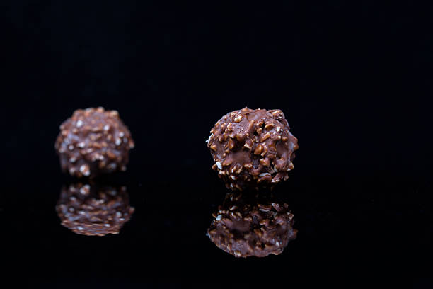 istock nut chocolate ball in black backgrounds 502867164