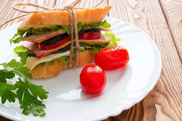 istock sandwich with white bread parsley and red cherry tomatoes 502867190