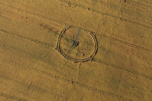 istock aerial view of electricity tower on harvest fields 502869090