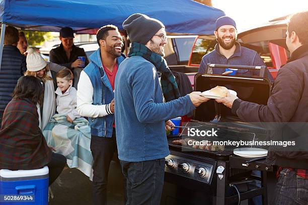 Group Of Sports Fans Tailgating In Stadium Car Park Stock Photo - Download Image Now