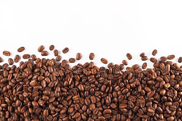 Coffee Beans Coffee beans on white background. roasted coffee bean photos stock pictures, royalty-free photos & images